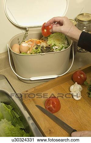 Stock Image - Organic Recycling, kitchen compost pail. Fotosearch