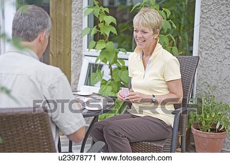 Senior couple playing cards on deck, Winnipeg, Canada View Large Photo Image Stock Image - Senior couple playing cards on deck, Winnipeg, Canada. Fotosearch