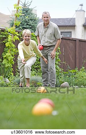 Senior couple plays bocce ball in backyard, Winnipeg, Canada View Large Photo Image Stock Photograph - Senior couple plays bocce ball in backyard, Winnipeg, Canada. Fotosearch