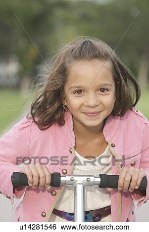 Seven year old girl on scooter, Winnipeg, Canada View Large Photo Image Stock Photograph - Seven year old girl on scooter, Winnipeg, Canada. Fotosearch