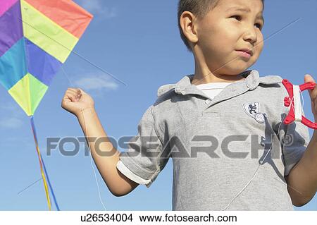 Six year old boy with kite, Winnipeg, Canada View Large Photo Image Picture - Six year old boy with kite, Winnipeg, Canada. Fotosearch