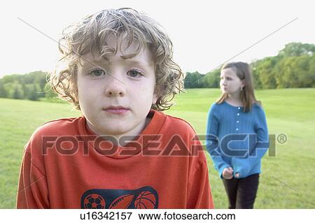 Six year old brother in foreground, 8 year old sister in background, Winnipeg, Canada View Large Photo Image Stock Photo - Six year old brother in foreground, 8 year old sister in background, Winnipeg, Canada. Fotosearch