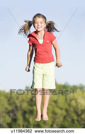Six year old girl jumping, Winnipeg, Canada View Large Photo Image Stock Image - Six year old girl jumping, Winnipeg, Canada. Fotosearch