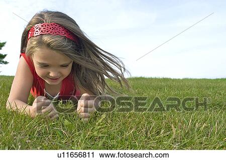 Six year old girl on grass, Winnipeg, Canada View Large Photo Image Stock Image - Six year old girl on grass, Winnipeg, Canada. Fotosearch