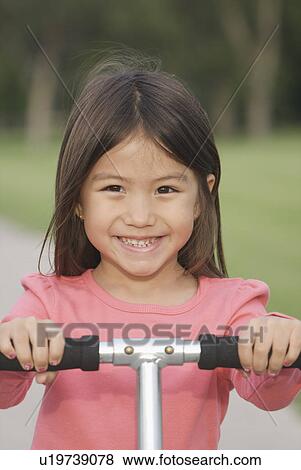 Six year old girl on scooter, Winnipeg, Canada View Large Photo Image Stock Photo - Six year old girl on scooter, Winnipeg, Canada. Fotosearch