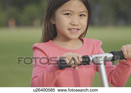 Six year old girl on scooter, Winnipeg, Canada View Large Photo Image Stock Photography - Six year old girl on scooter, Winnipeg, Canada. Fotosearch
