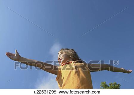Six year old girl with arms outstretched, Winnipeg, Canada View Large Photo Image Stock Photography - Six year old girl with arms outstretched, Winnipeg, Canada. Fotosearch