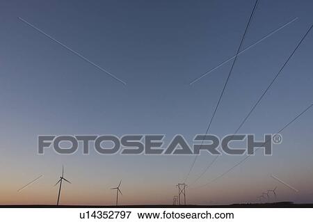Sunset, wind turbines and power lines View Large Photo Image Stock Photo - Sunset, wind turbines and power lines. Fotosearch