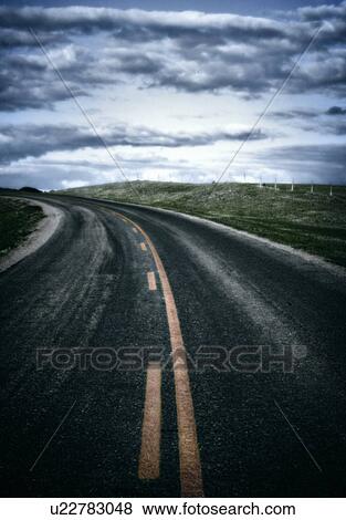 Stock Photo - Textured image of curve in road, Regina, Saskatchewan. Fotosearch