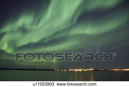 The first signs of autumn Aurora Borealis emerge resulting in dramatic reflections in the water. Photographed at the Great Slave dock in Yellowknife. View Large Photo Image Stock Image - The first signs of autumn Aurora Borealis emerge resulting in dramatic reflections in the water. Photographed at the Great Slave dock in Yellowknife.. Fotosearch