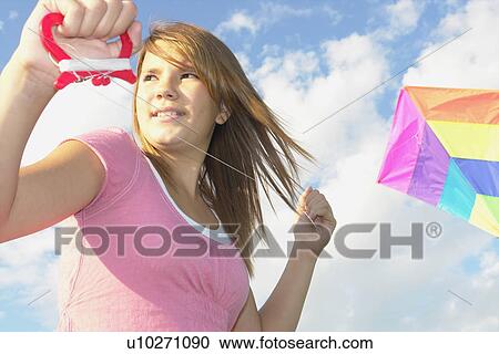 Thirteen year old girl with kite, Winnipeg, Canada View Large Photo Image Stock Image - Thirteen year old girl with kite, Winnipeg, Canada. Fotosearch