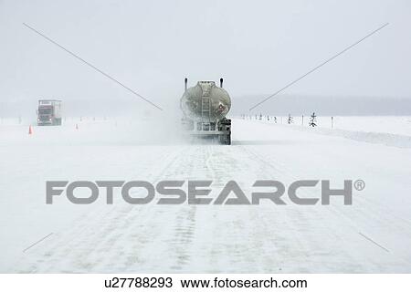 Transport trucks make their way across the MacKenzie River ice crossing (which is serviced by a ferry in the summer months) just outside Fort Providence, Northwest Territories. View Large Photo Image Stock Image - Transport trucks make their way across the MacKenzie River ice crossing (which is serviced by a ferry in the summer months) just outside Fort Providence, Northwest Territories.. Fotosearch