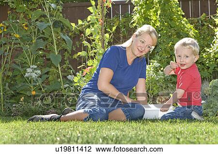 Two year old boy with mother shows off beans from backyard, Winnipeg, Canada View Large Photo Image Stock Image - Two year old boy with mother shows off beans from backyard, Winnipeg, Canada. Fotosearch