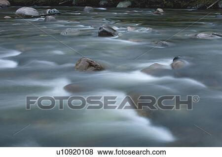Water flowing over rocks, Gaspesie, Sainte-Anne River, Quebec View Large Photo Image Stock Photo - Water flowing over rocks, Gaspesie, Sainte-Anne River, Quebec. Fotosearch