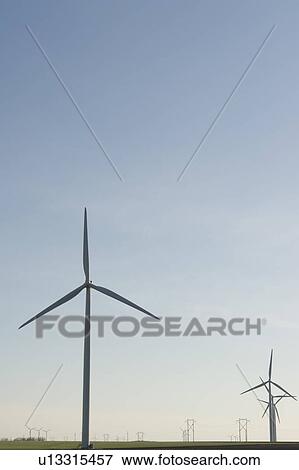 Stock Photo - Wind turbines and hydroelectric towers. Fotosearch
