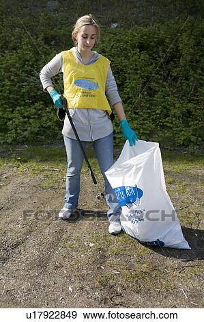 Young woman helps with community clean-up, Vancouver, Canada View Large Photo Image Stock Photo - Young woman helps with community clean-up, Vancouver, Canada. Fotosearch