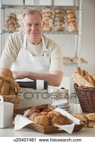 Stock Image - A baker in a bakery. Fotosearch