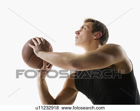 Stock Photo - A basketball player. Fotosearch