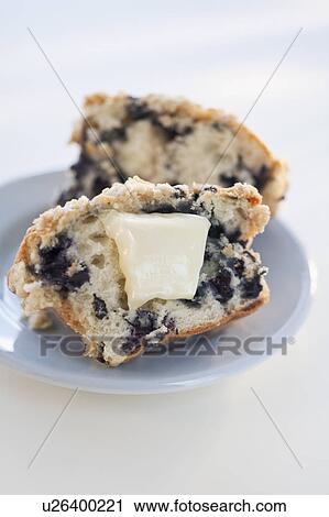 A blueberry muffin with butter View Large Photo Image Stock Image - A blueberry muffin with butter. Fotosearch