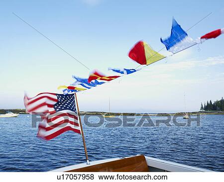 A boat with an American flag View Large Photo Image Stock Photo - A boat with an American flag. Fotosearch