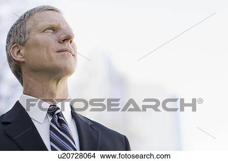 Picture - A businessman outdoors. Fotosearch