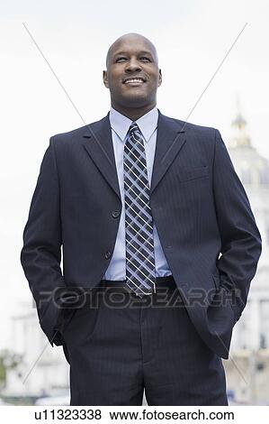Stock Photo - A businessman outdoors. Fotosearch