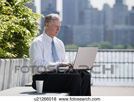 A businessman outdoors View Large Photo Image Stock Photo - A businessman outdoors. Fotosearch