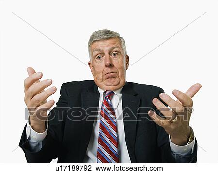 A businessman shrugging View Large Photo Image Stock Image - A businessman shrugging. Fotosearch