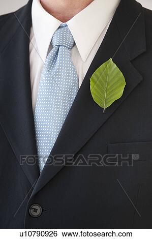 Stock Photograph - A businessman with a leaf in his lapel. Fotosearch