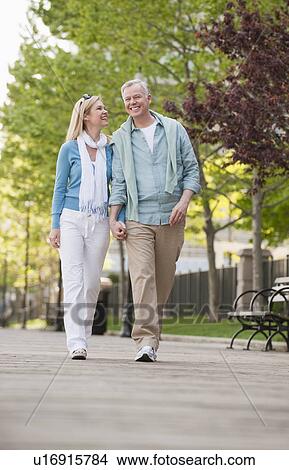 A couple at a park View Large Photo Image Picture - A couple at a park. Fotosearch