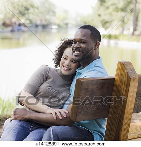 A couple at a park View Large Photo Image Stock Image - A couple at a park. Fotosearch