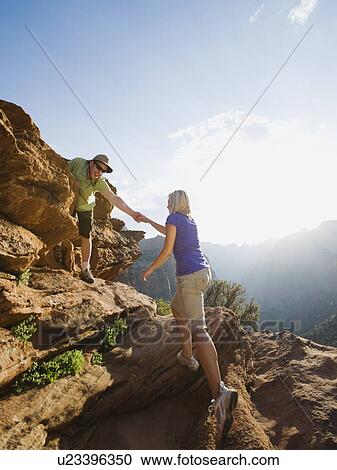 Stock Image - A couple at Red Rock. Fotosearch