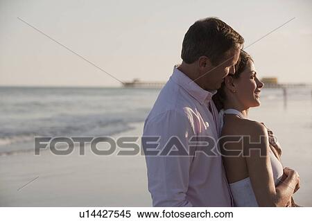A couple at the beach View Large Photo Image Stock Photography - A couple at the beach. Fotosearch