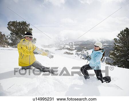 A couple outdoors in the snow View Large Photo Image Stock Image - A couple outdoors in the snow. Fotosearch