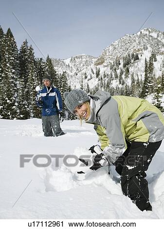 A couple outdoors in the snow View Large Photo Image Stock Image - A couple outdoors in the snow. Fotosearch