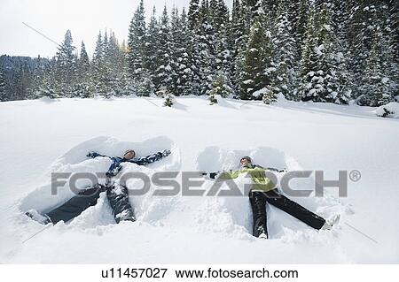 Stock Photo - A couple outdoors in the snow. Fotosearch