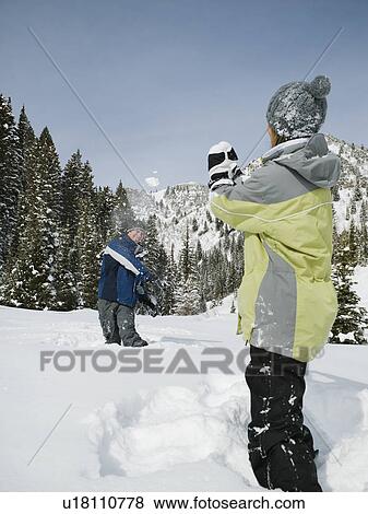 Stock Photo - A couple outdoors in the snow. Fotosearch