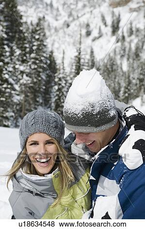 Stock Photo - A couple outdoors in the snow. Fotosearch