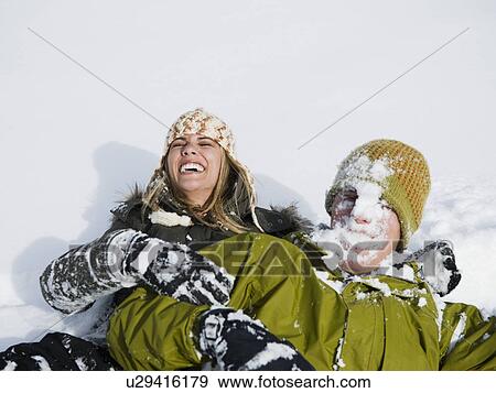 A couple outdoors in the snow View Large Photo Image Stock Photo - A couple outdoors in the snow. Fotosearch
