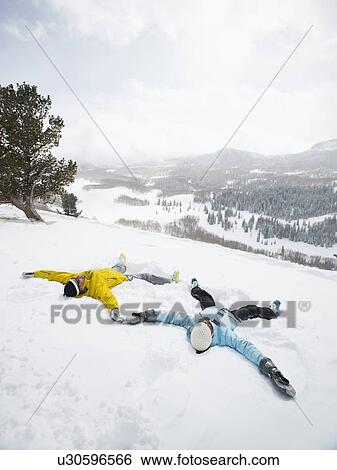 A couple outdoors in the snow View Large Photo Image Stock Photograph - A couple outdoors in the snow. Fotosearch