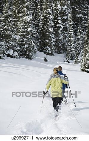 A couple snow shoeing View Large Photo Image Stock Image - A couple snow shoeing. Fotosearch