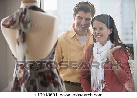 A couple window shopping View Large Photo Image Stock Image - A couple window shopping. Fotosearch