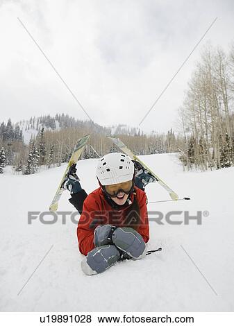 Stock Photo - A downhill skier falling. Fotosearch
