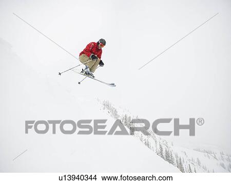 Picture - A downhill skier jumping. Fotosearch