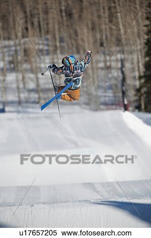 A downhill skier jumping View Large Photo Image Stock Photography - A downhill skier jumping. Fotosearch