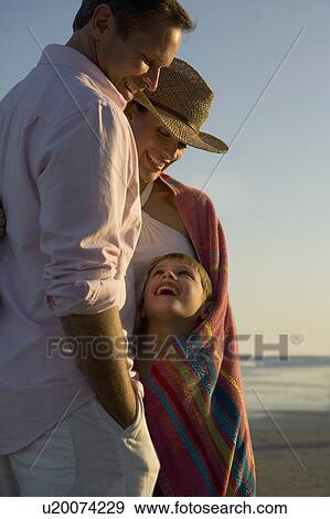Stock Photo - A family at the beach. Fotosearch