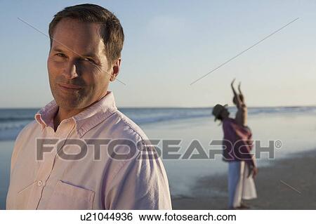 A family at the beach View Large Photo Image Stock Photograph - A family at the beach. Fotosearch