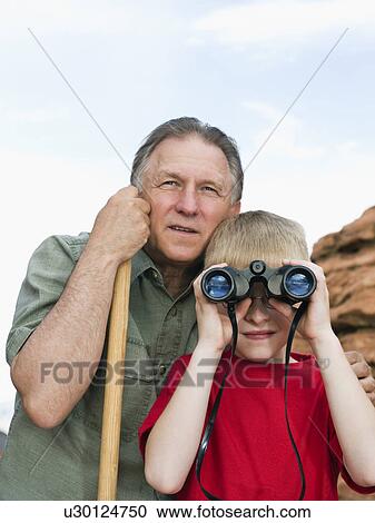 Stock Image - A father and son at Red Rock. Fotosearch