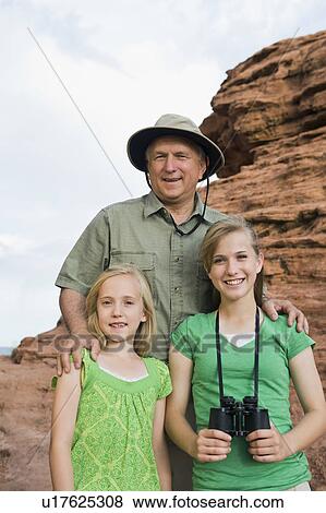 Stock Photo - A father and two daughters at Red Rock. Fotosearch