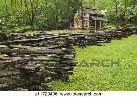 Stock Photograph - A fence and cabin in Smoky Mountain National Park. Fotosearch